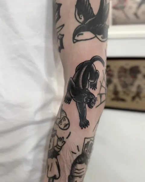 Ignorant tatuaż czarnej pantery na przedramieniu — Tattoo, Wujek Darek Tattoo, Warszawa
