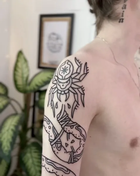 Ignorant tatuaż skarabeusza i węża na ramieniu z grubym konturem — Tattoo, Wujek Darek Tattoo, Warszawa